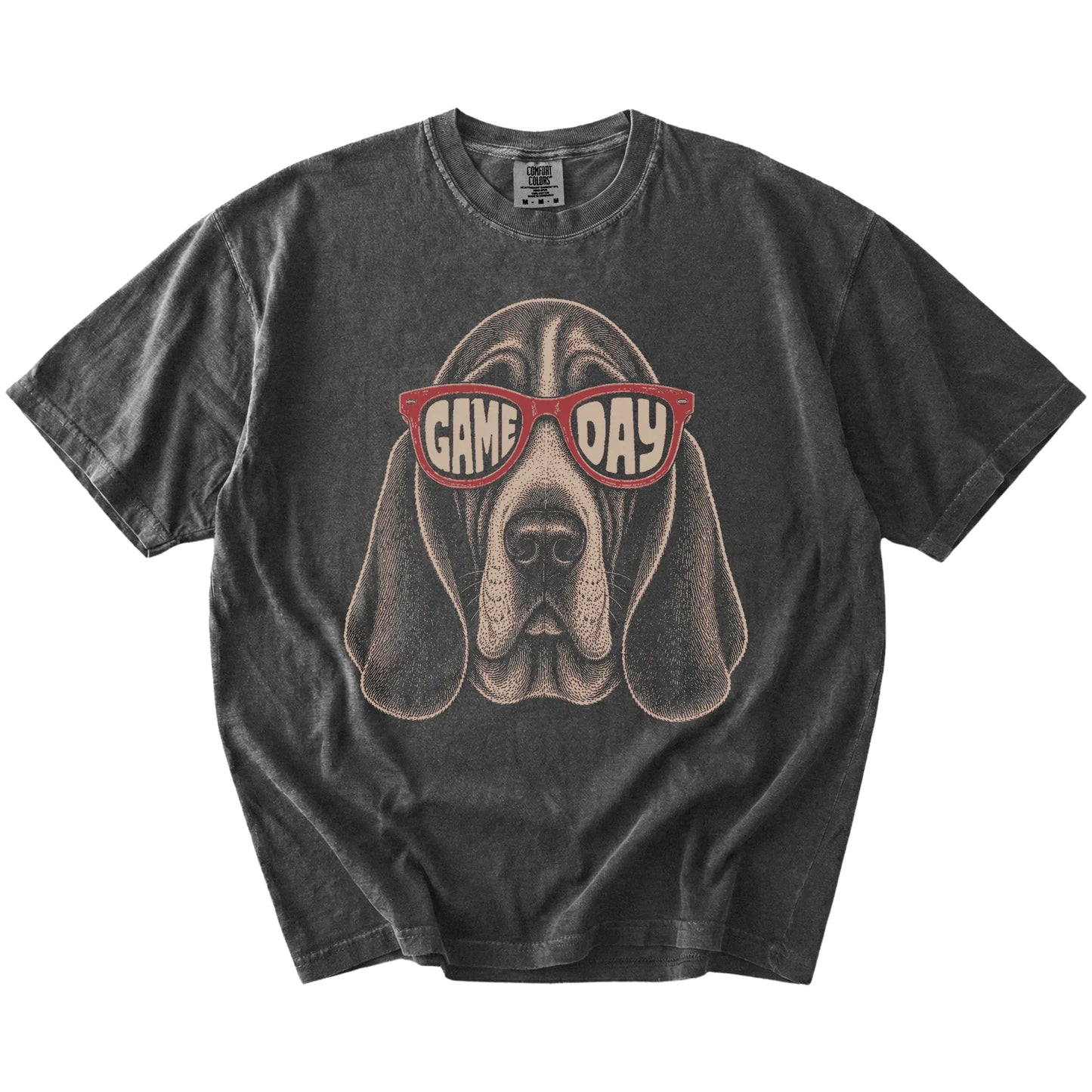 Basset Hound wearing red Game Day sunglasses on a Pepper Comfort Colors® T-shirt