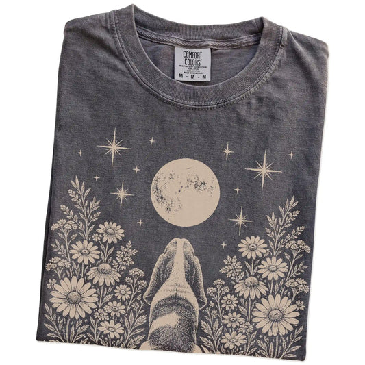 Folded Pepper Comfort Colors® T-shirt showing Basset Hound beneath a wildflower moon