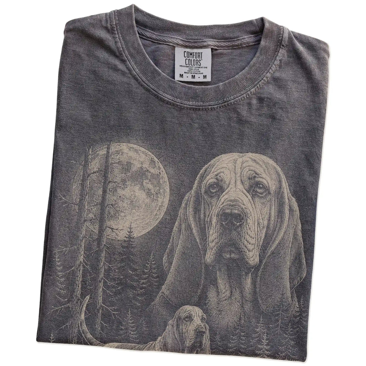 Folded Pepper Basset Hound Moonlit Forest T-Shirt showing the graphic