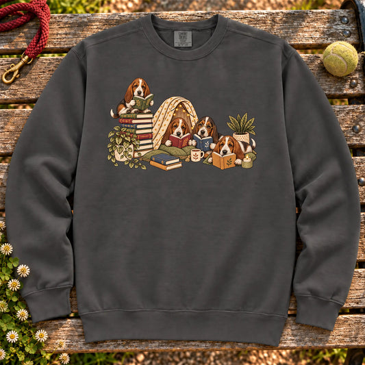 Basset Hound puppies reading books in a cozy blanket fort on a Pepper sweatshirt