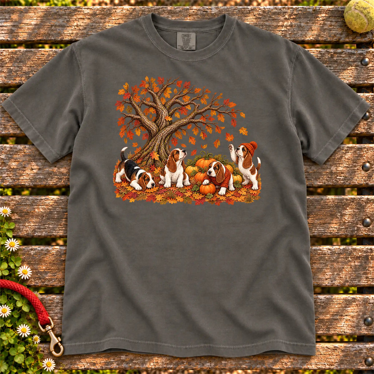 Four Basset Hound puppies with pumpkins beneath an autumn tree on a Pepper garment-dyed T-shirt