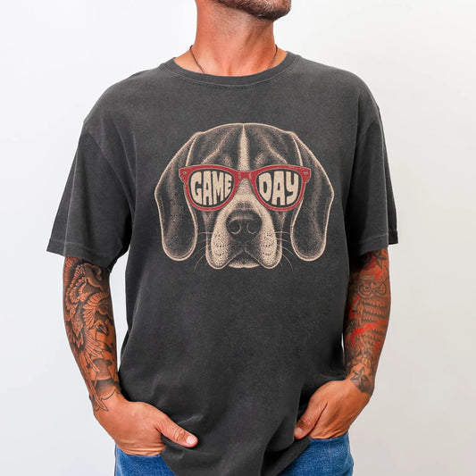 Model wearing a Pepper Comfort Colors® T-shirt with beagle wearing red game day sunglasses