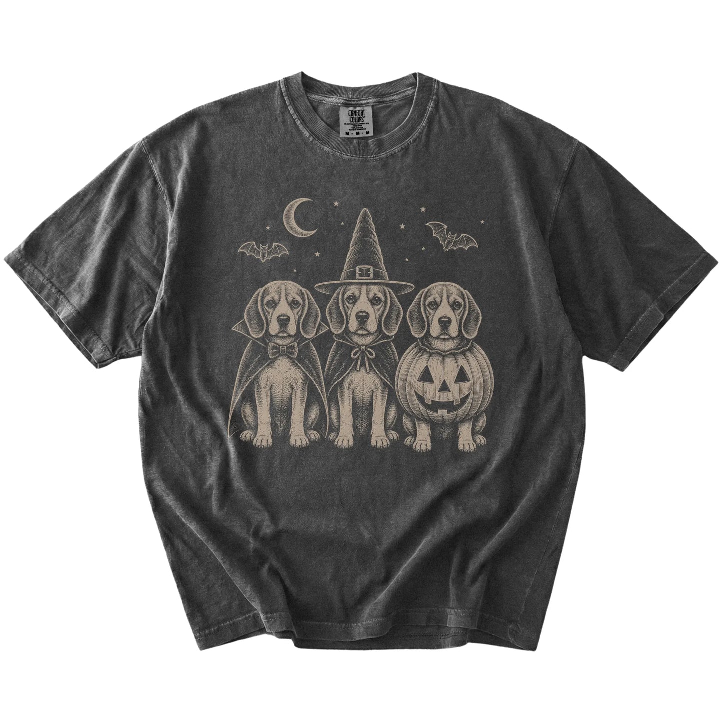 Three Beagle dogs dressed for Halloween beneath bats and a crescent moon on a Pepper Comfort Colors® T-shirt
