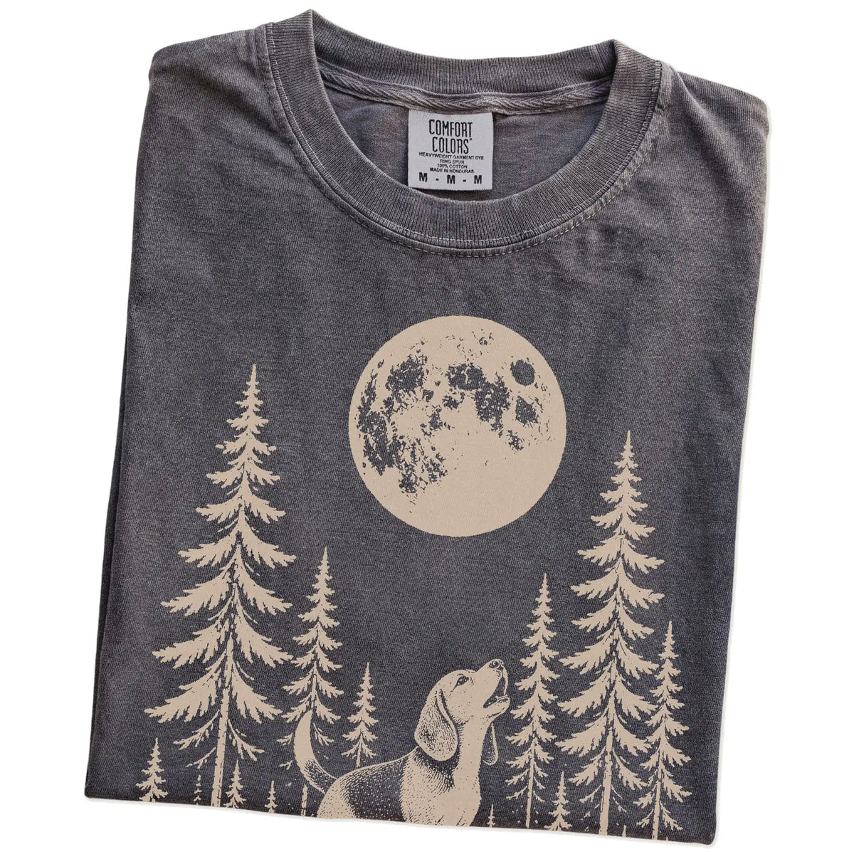 Folded Pepper Comfort Colors® T-shirt showing a Beagle howling beneath the moon and pine trees