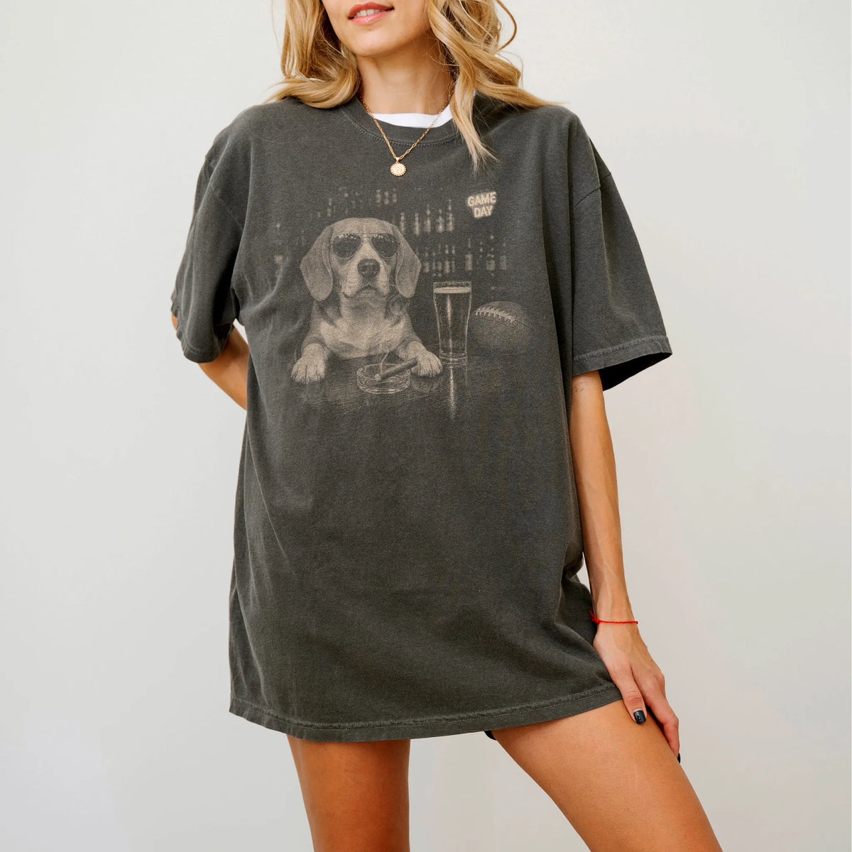 Model wearing a Pepper Comfort Colors® T-shirt featuring Beagle with beer and football graphics