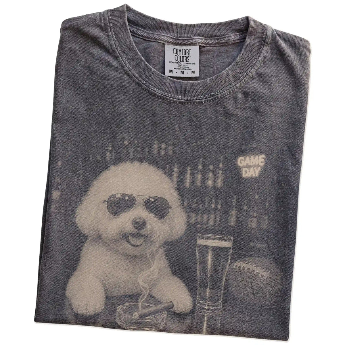 Folded Pepper Comfort Colors® T-shirt showing Bichon Frise with beer and football graphics