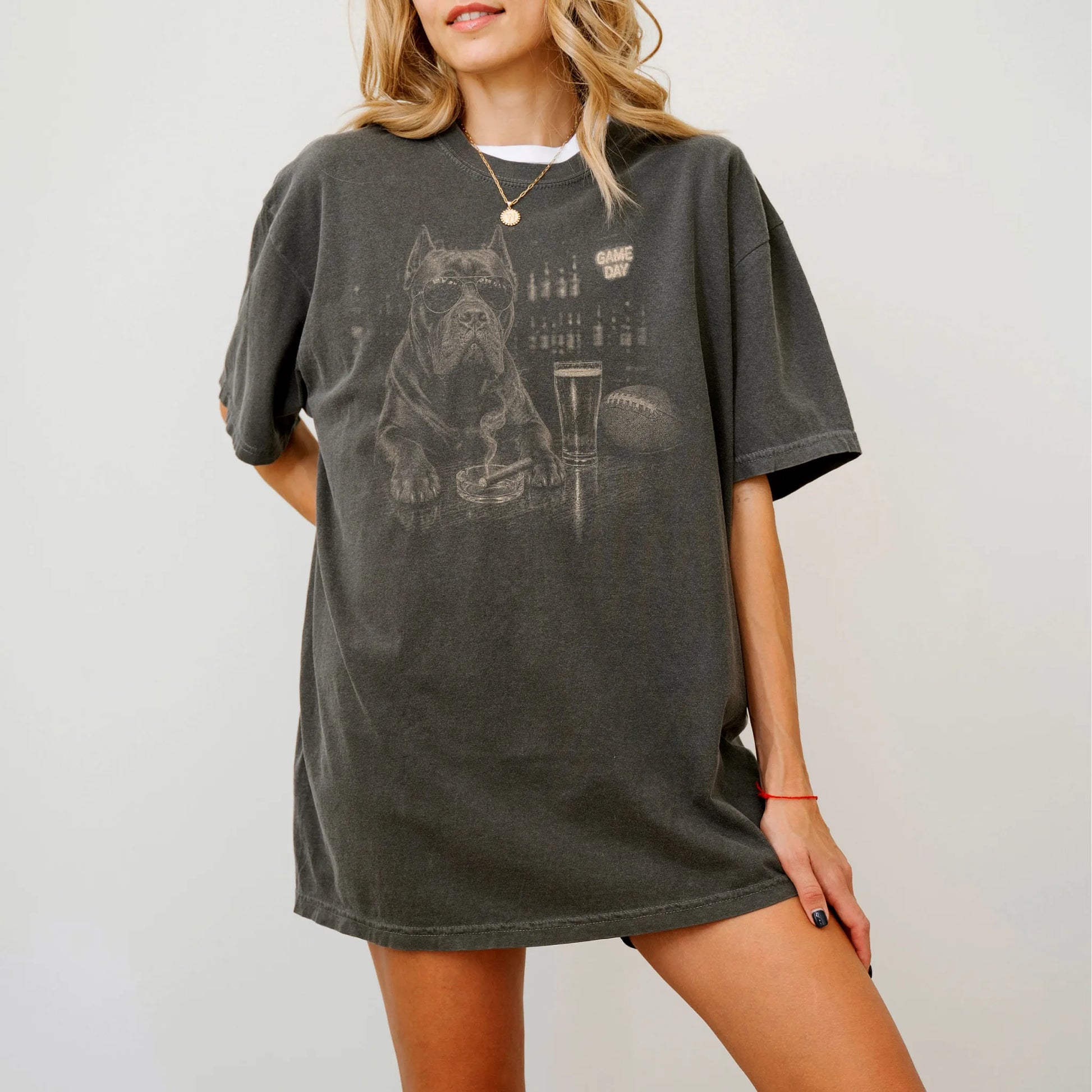 Model wearing a Pepper Comfort Colors® T-shirt featuring Cane Corso with beer and football graphics