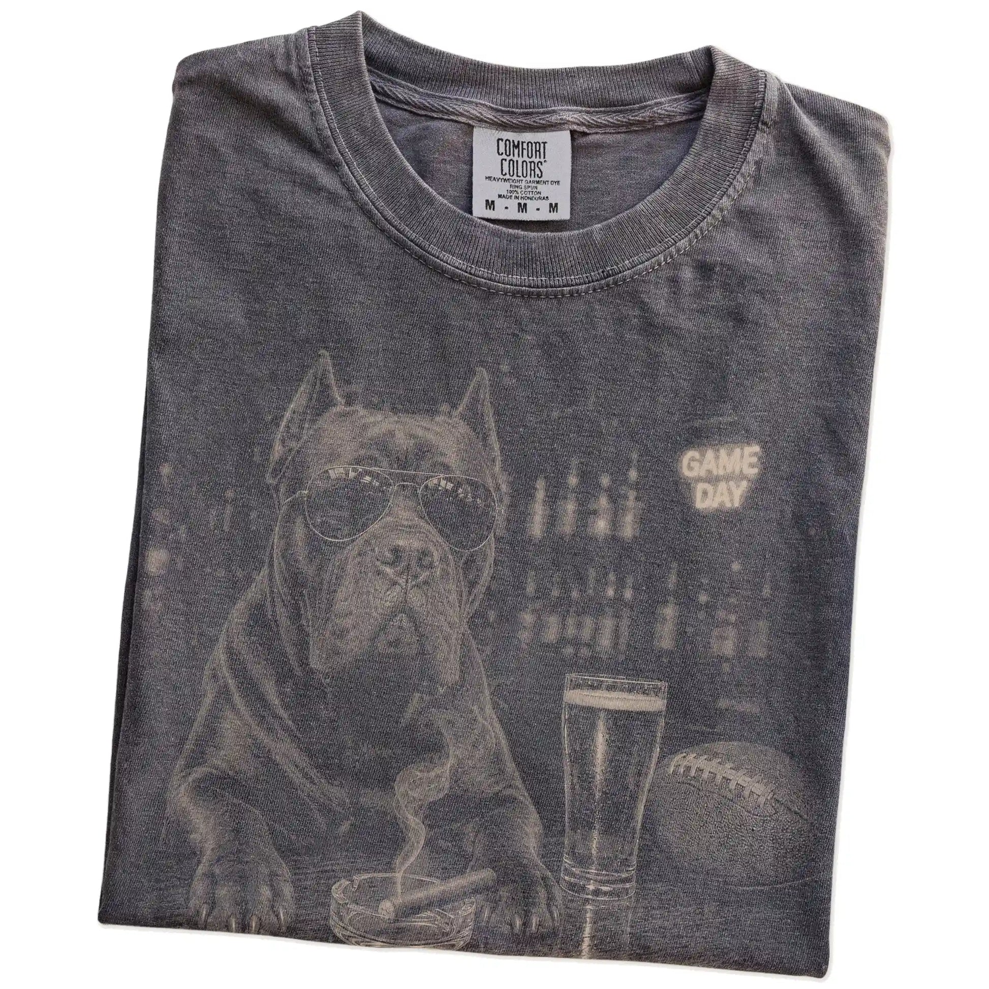 Folded Pepper Comfort Colors® T-shirt showing Cane Corso with beer and football graphics