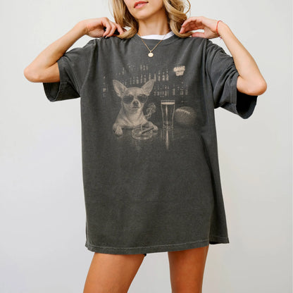 Model wearing a Pepper Comfort Colors® T-shirt featuring Chihuahua with beer and football graphics