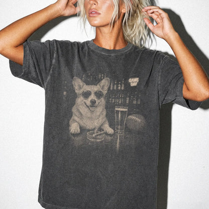 Model wearing a Pepper Comfort Colors® T-shirt featuring Corgi with beer and football graphics