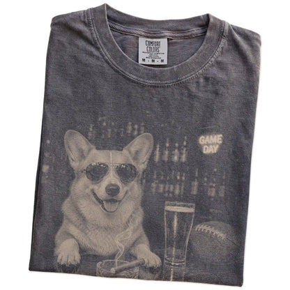 Folded Pepper Comfort Colors® T-shirt showing Corgi with beer and football graphics