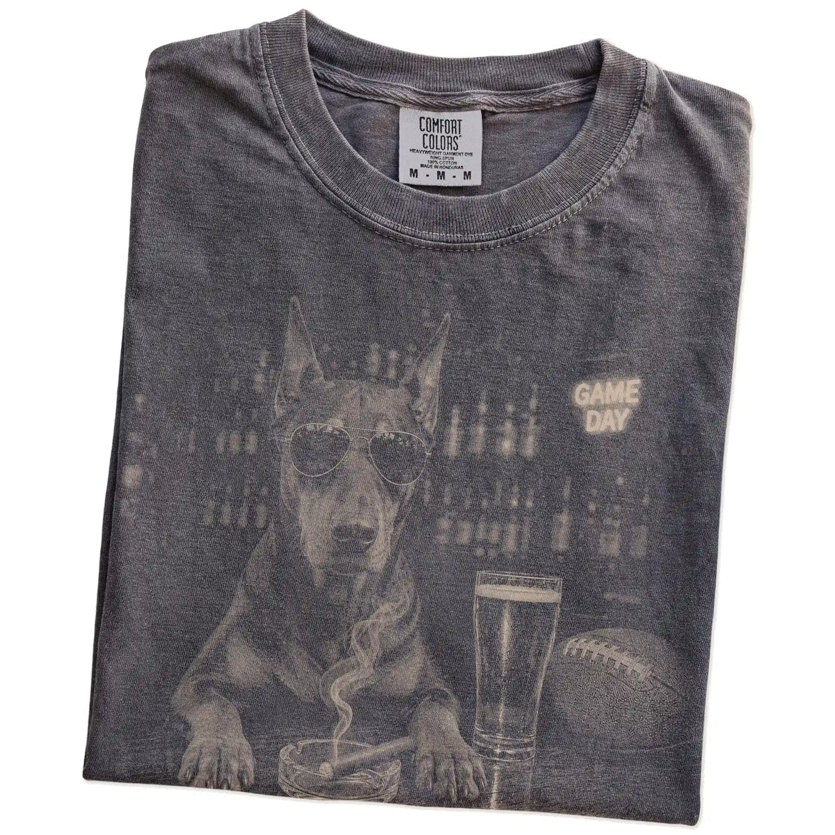 Folded Pepper Comfort Colors® T-shirt showing Doberman with beer and football graphics