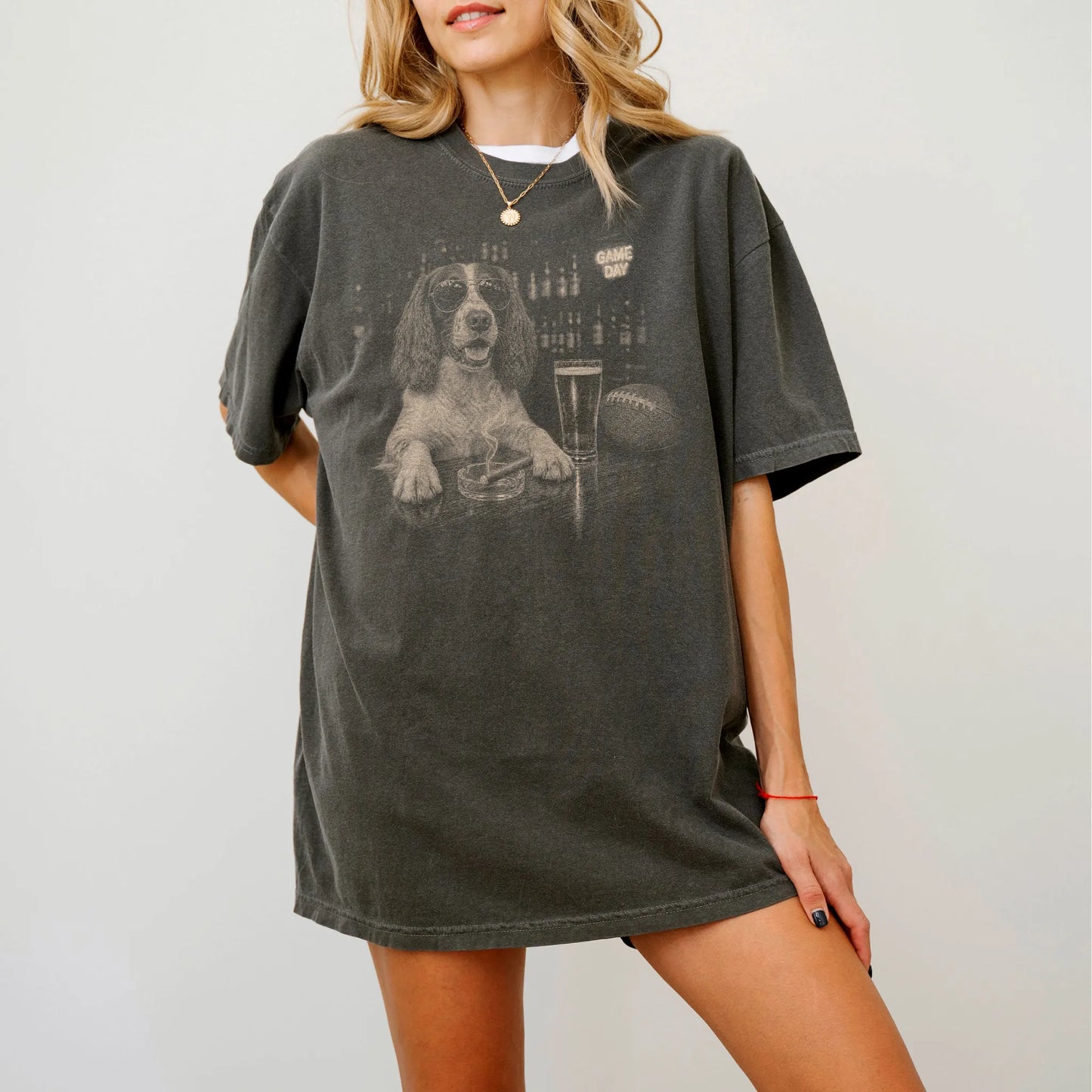 Model wearing a Pepper Comfort Colors® T-shirt featuring Springer Spaniel with beer and football graphics