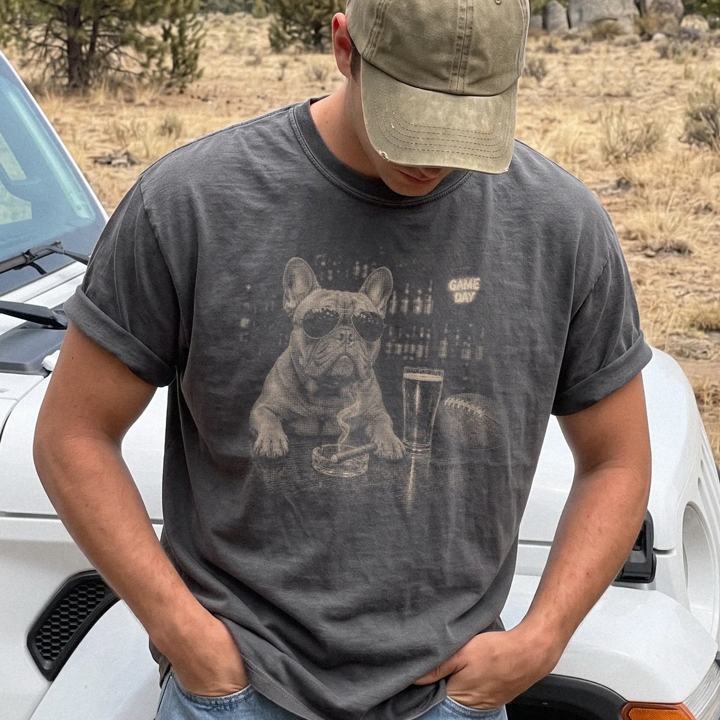 Model wearing a Pepper Comfort Colors® T-shirt featuring French Bulldog with beer and football graphics