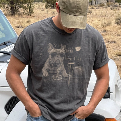 Model wearing a Pepper Comfort Colors® T-shirt featuring French Bulldog with beer and football graphics