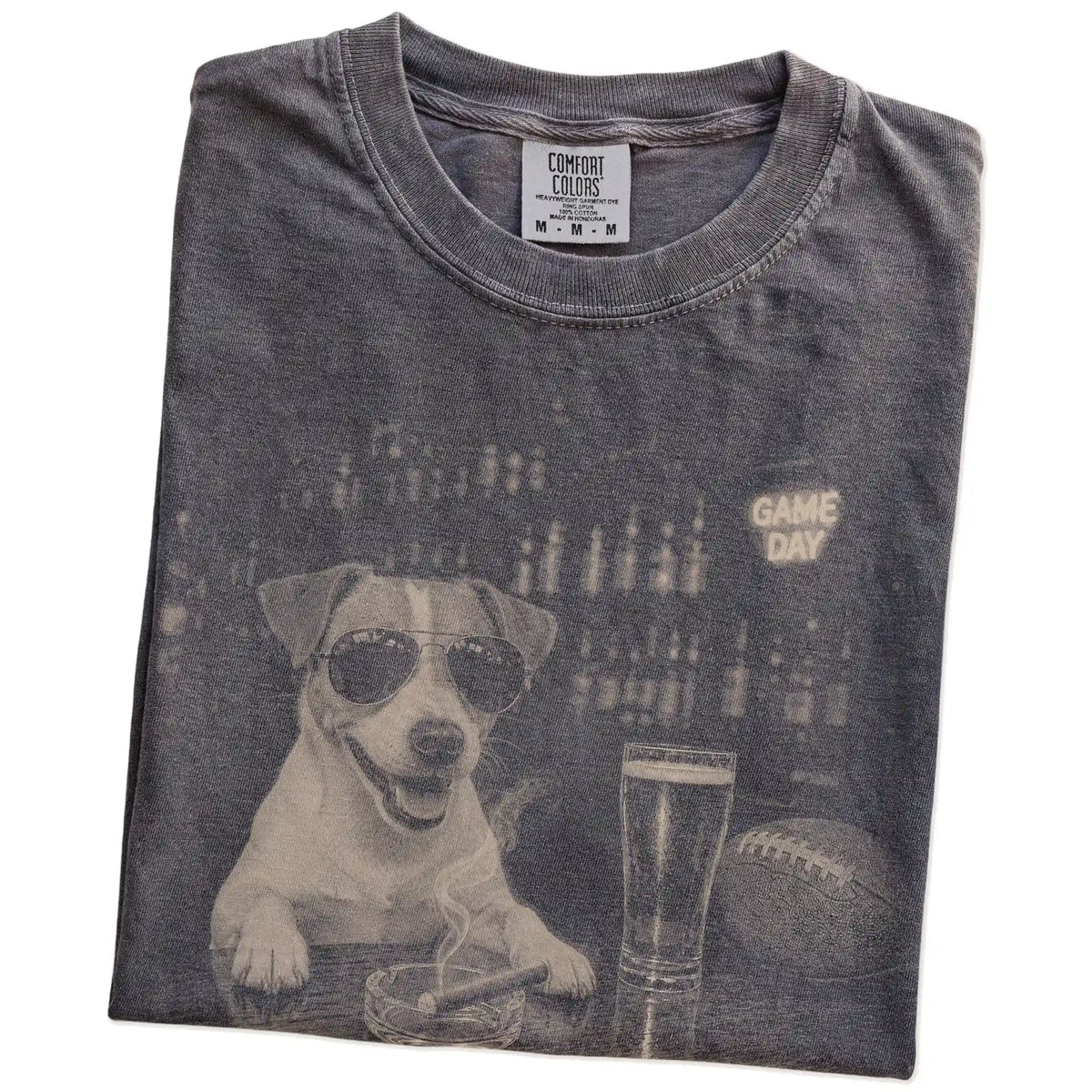 Folded Pepper Comfort Colors® T-shirt showing Jack Russell with beer and football graphics