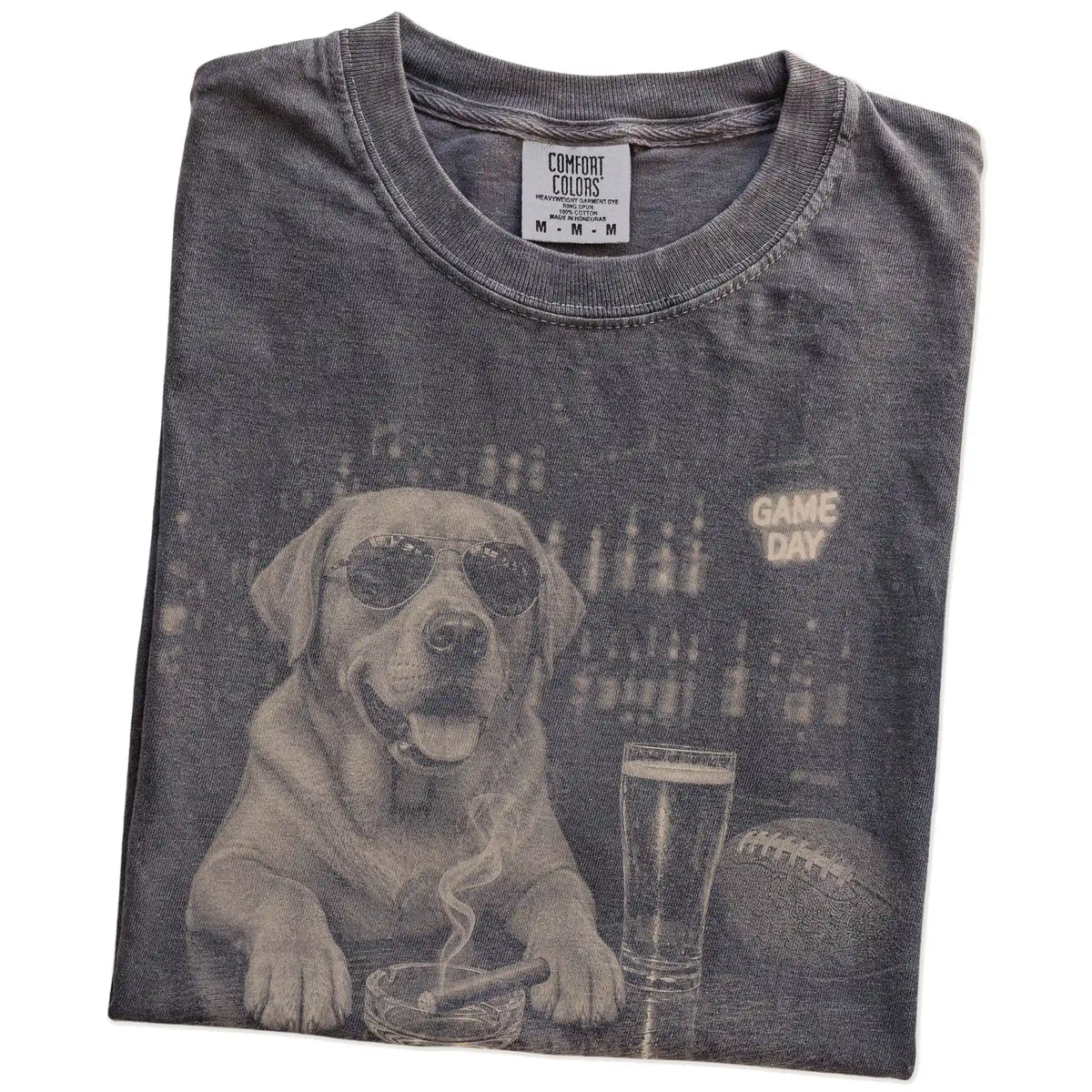 Folded Pepper Comfort Colors® T-shirt showing Labrador Retriever with beer and football graphics