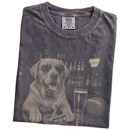 Folded Pepper Comfort Colors® T-shirt showing Labrador Retriever with beer and football graphics