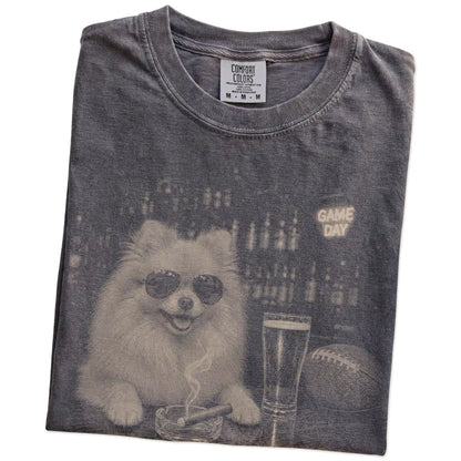 Folded Pepper Comfort Colors® T-shirt showing Pomeranian with beer and football graphics