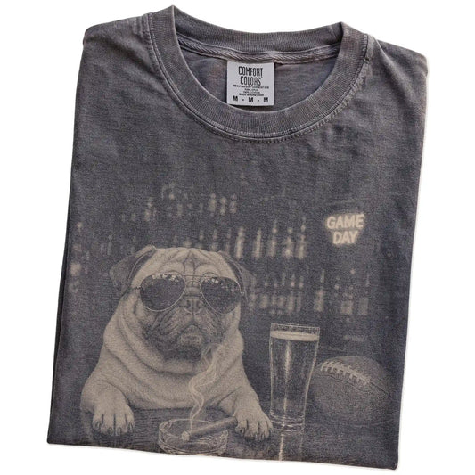 Folded Pepper Comfort Colors® T-shirt showing Pug with beer and football graphics