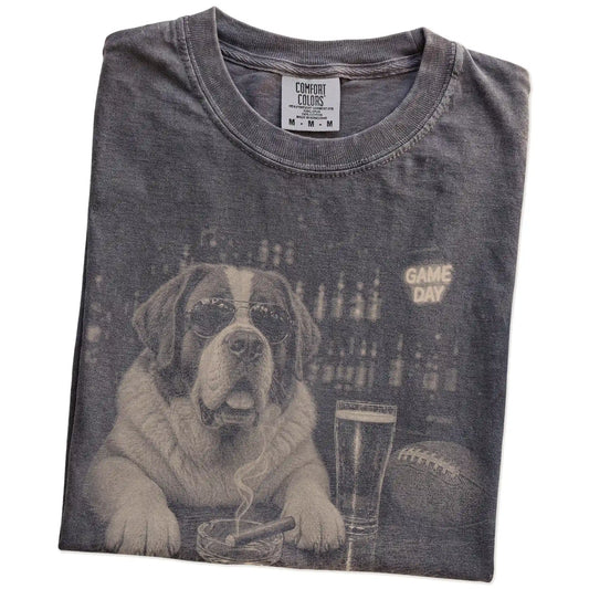 Folded Pepper Comfort Colors® T-shirt showing Saint Bernard with beer and football graphics