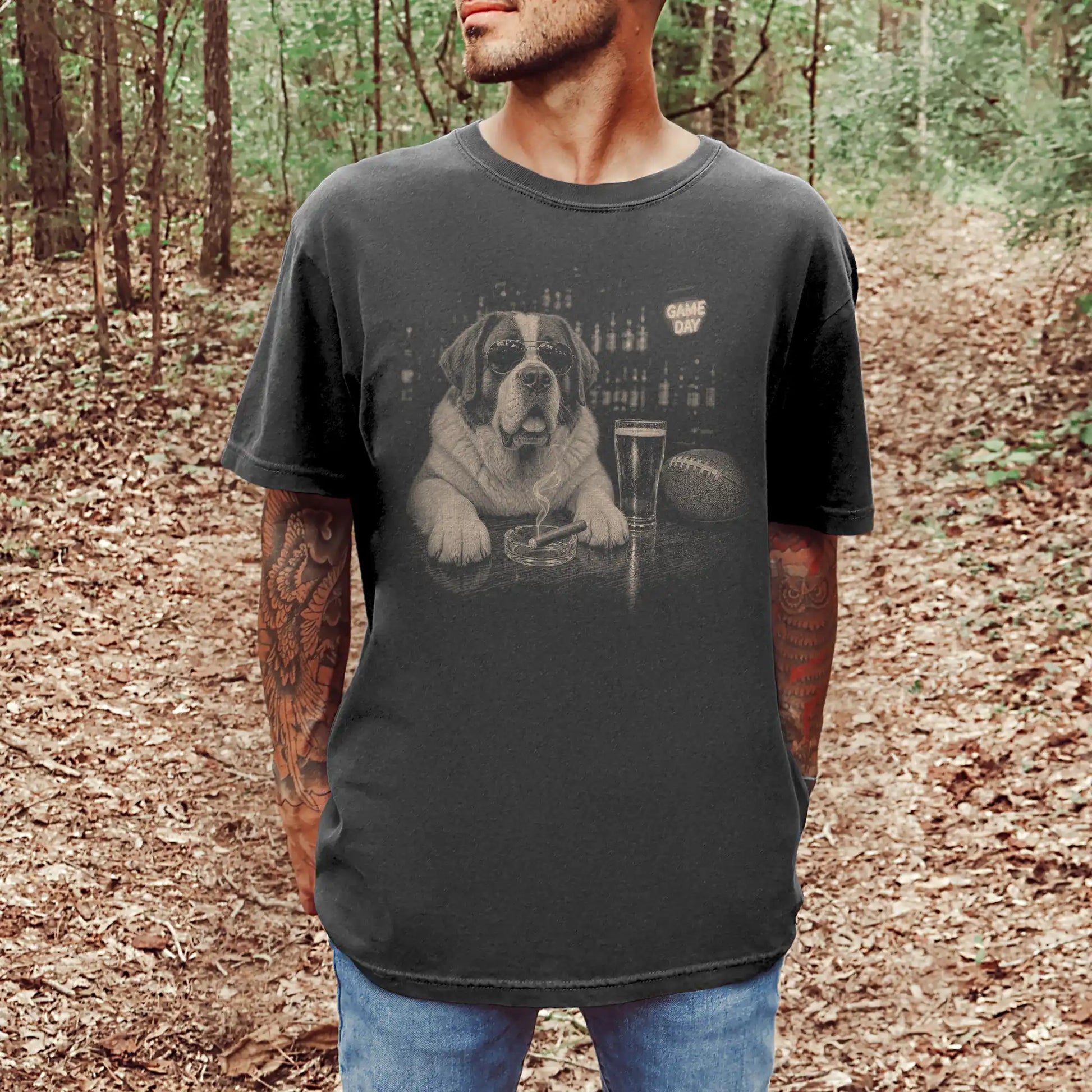Model wearing a Pepper Comfort Colors® T-shirt featuring Saint Bernard with beer and football graphics