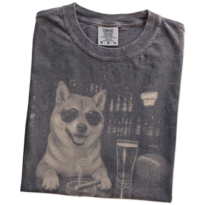 Folded Pepper Comfort Colors® T-shirt showing Shiba Inu with beer and football graphics