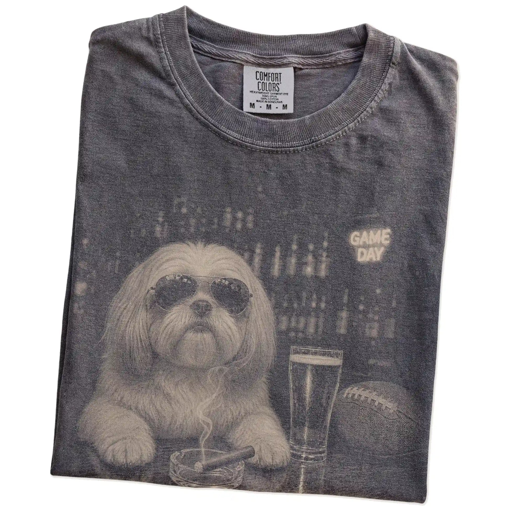 Folded Pepper Comfort Colors® T-shirt showing Shih Tzu with beer and football graphics