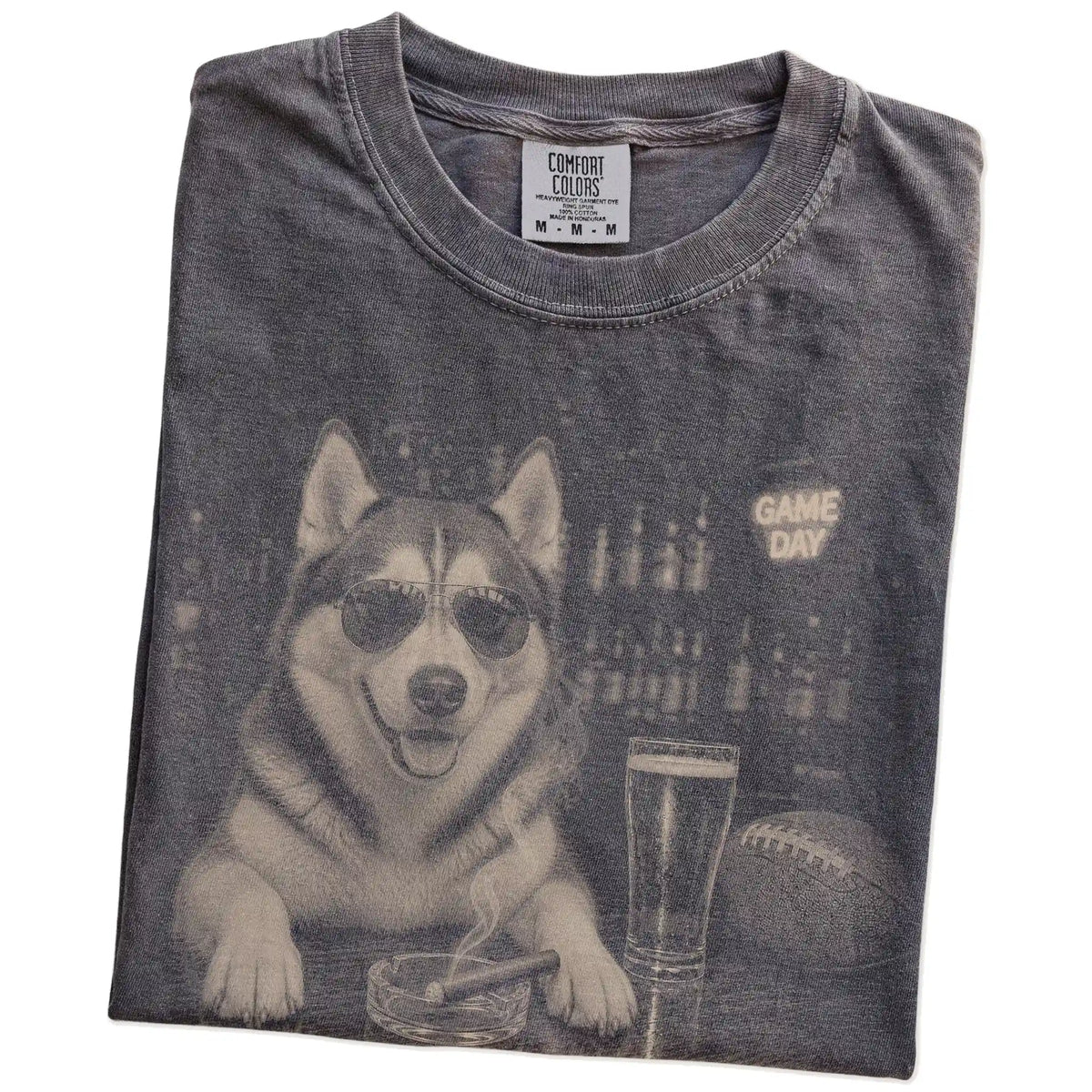 Folded Pepper Comfort Colors® T-shirt showing Husky with beer and football graphics