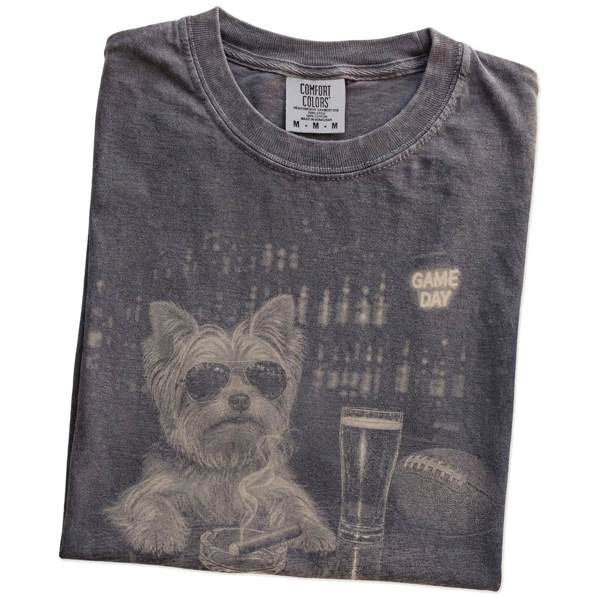 Folded Pepper Comfort Colors® T-shirt showing Yorkie with beer and football graphics