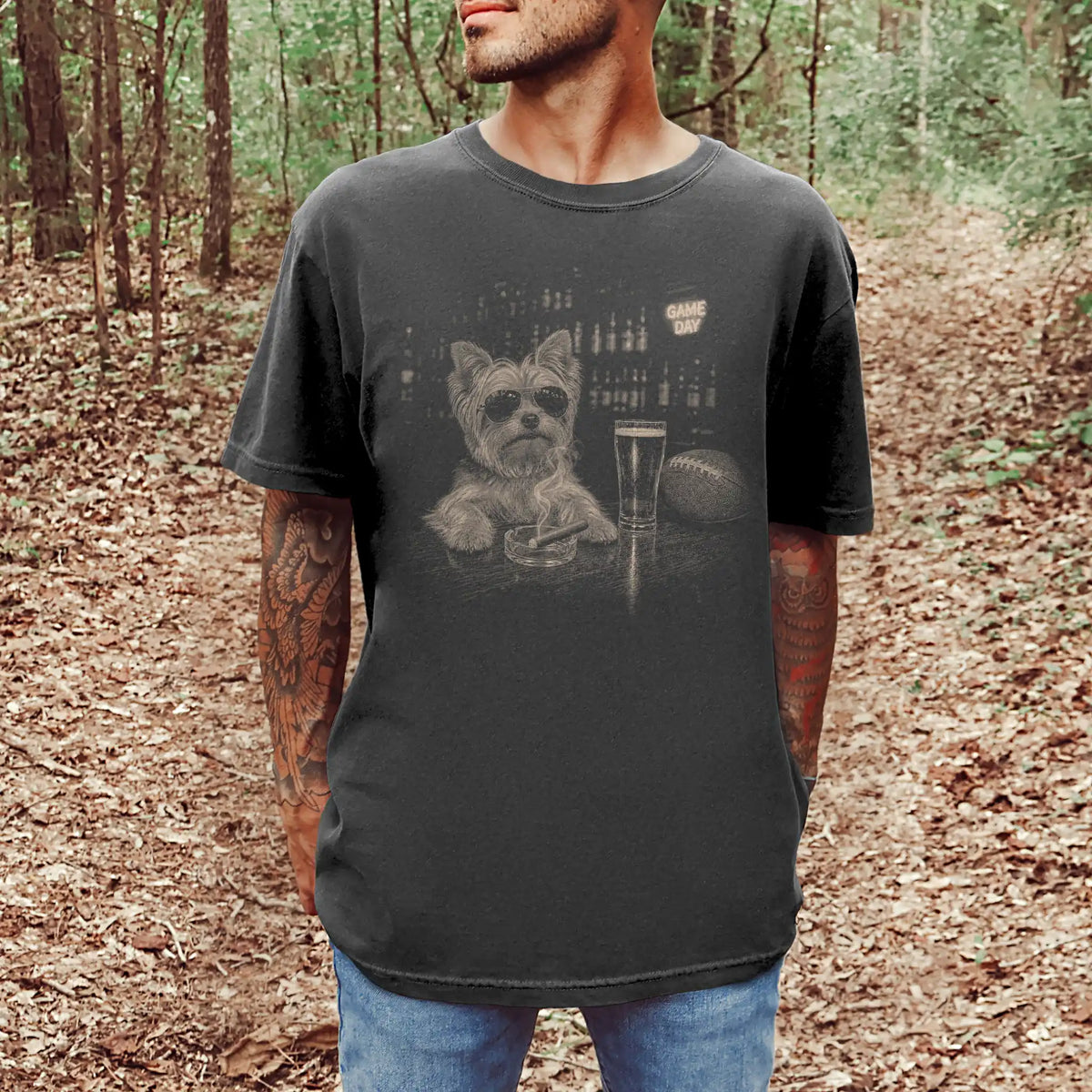 Model wearing a Pepper Comfort Colors® T-shirt featuring Yorkie with beer and football graphics