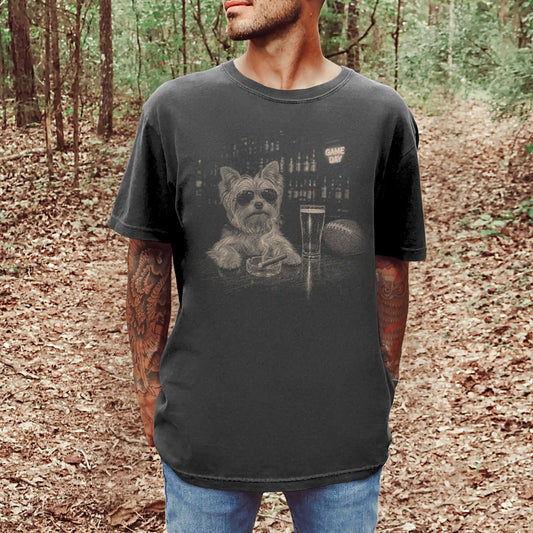 Model wearing a Pepper Comfort Colors® T-shirt featuring Yorkie with beer and football graphics