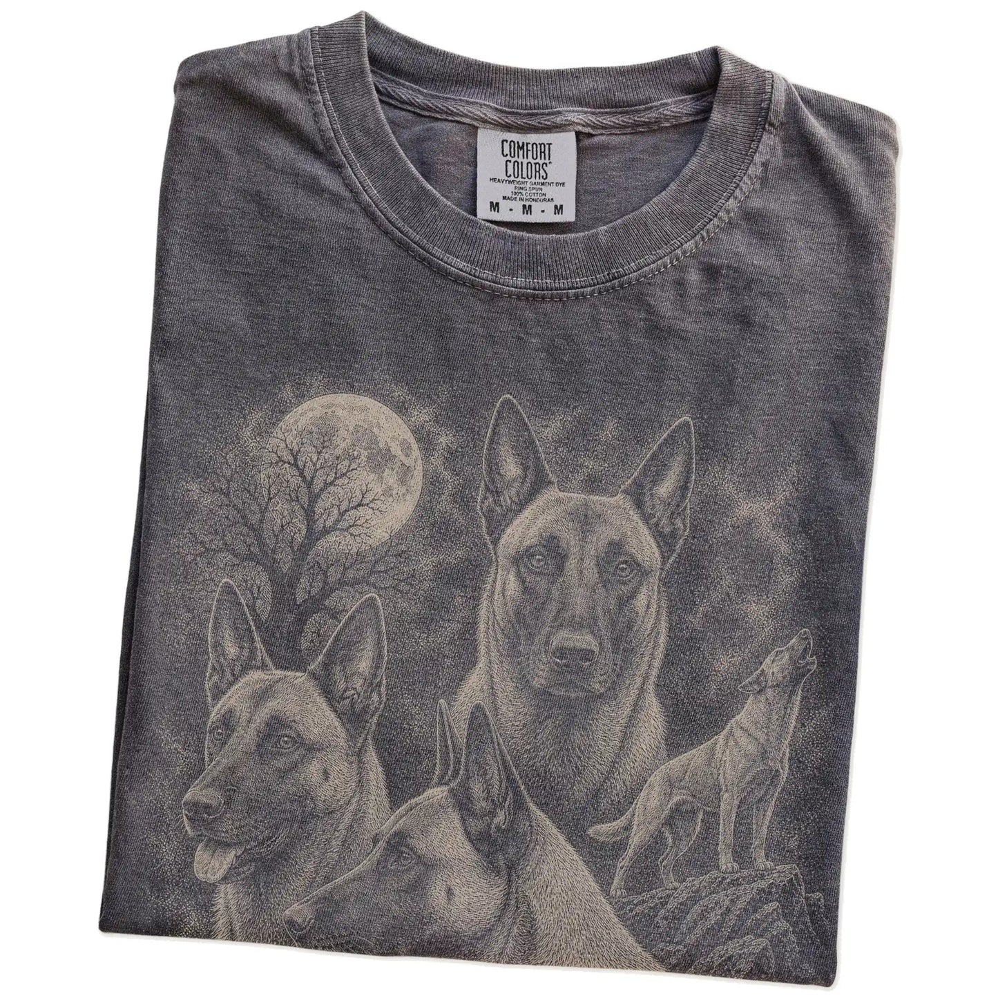 Folded Pepper Comfort Colors® T-shirt showing a vintage moon montage featuring Belgian Malinois