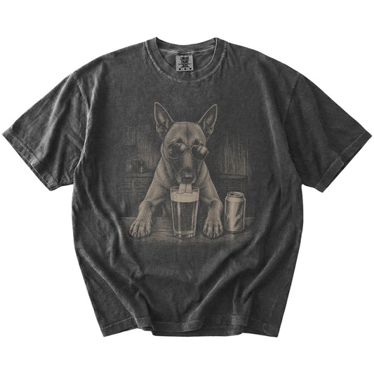 Belgian Malinois sneaking a drink from a foamy pint at home on a Pepper Comfort Colors® t-shirt