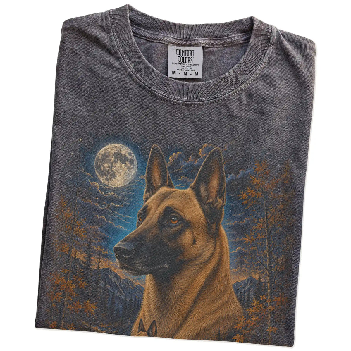 Folded Pepper Comfort Colors® t-shirt showing Belgian Malinois in a fall forest graphic