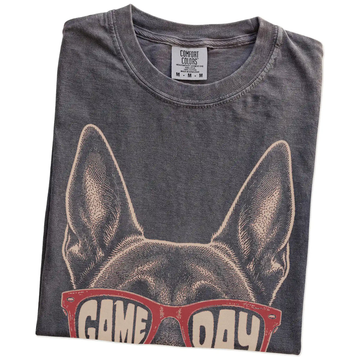 Folded Pepper Comfort Colors® T-shirt showing belgian malinois wearing red game day sunglasses