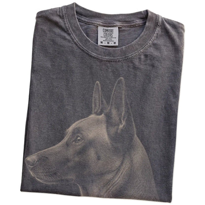 Folded Pepper Comfort Colors® T-shirt showing a detailed photographic portrait of a Belgian Malinois