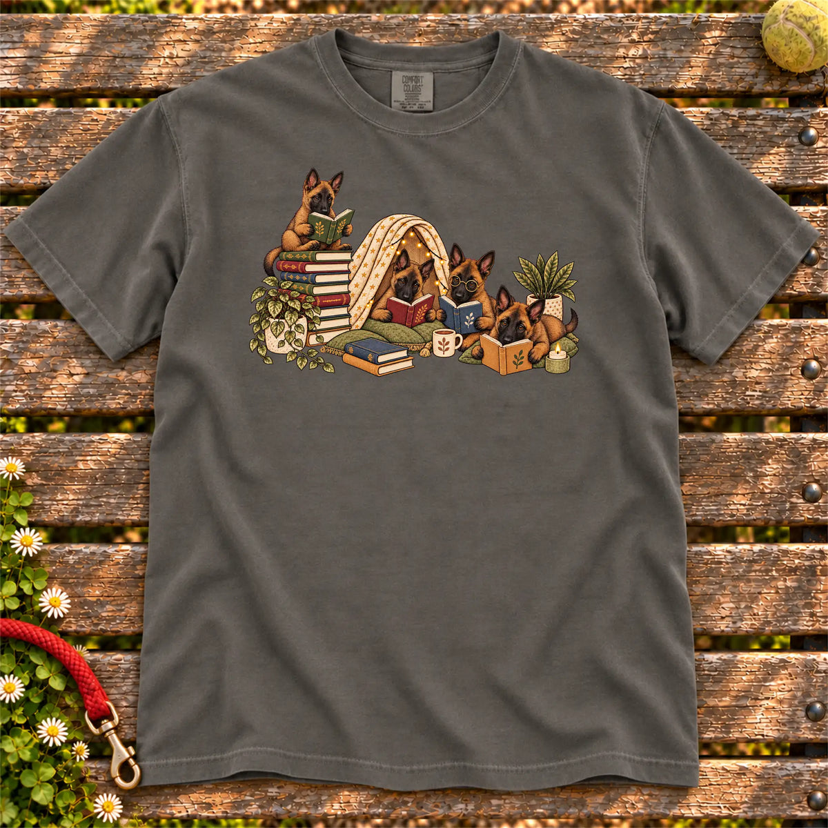 Belgian Malinois puppies reading books in a cozy blanket fort on a Pepper T-shirt