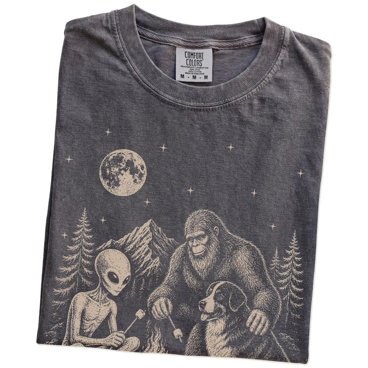 Folded Pepper Comfort Colors® T-shirt showing Bernese Mountain Dog camping with Bigfoot and an alien