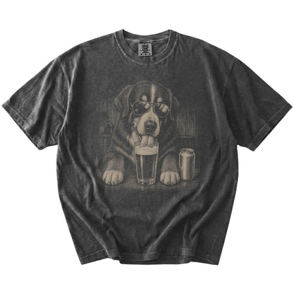 Bernese Mountain Dog sneaking a drink from a foamy pint at home on a Pepper Comfort Colors® t-shirt