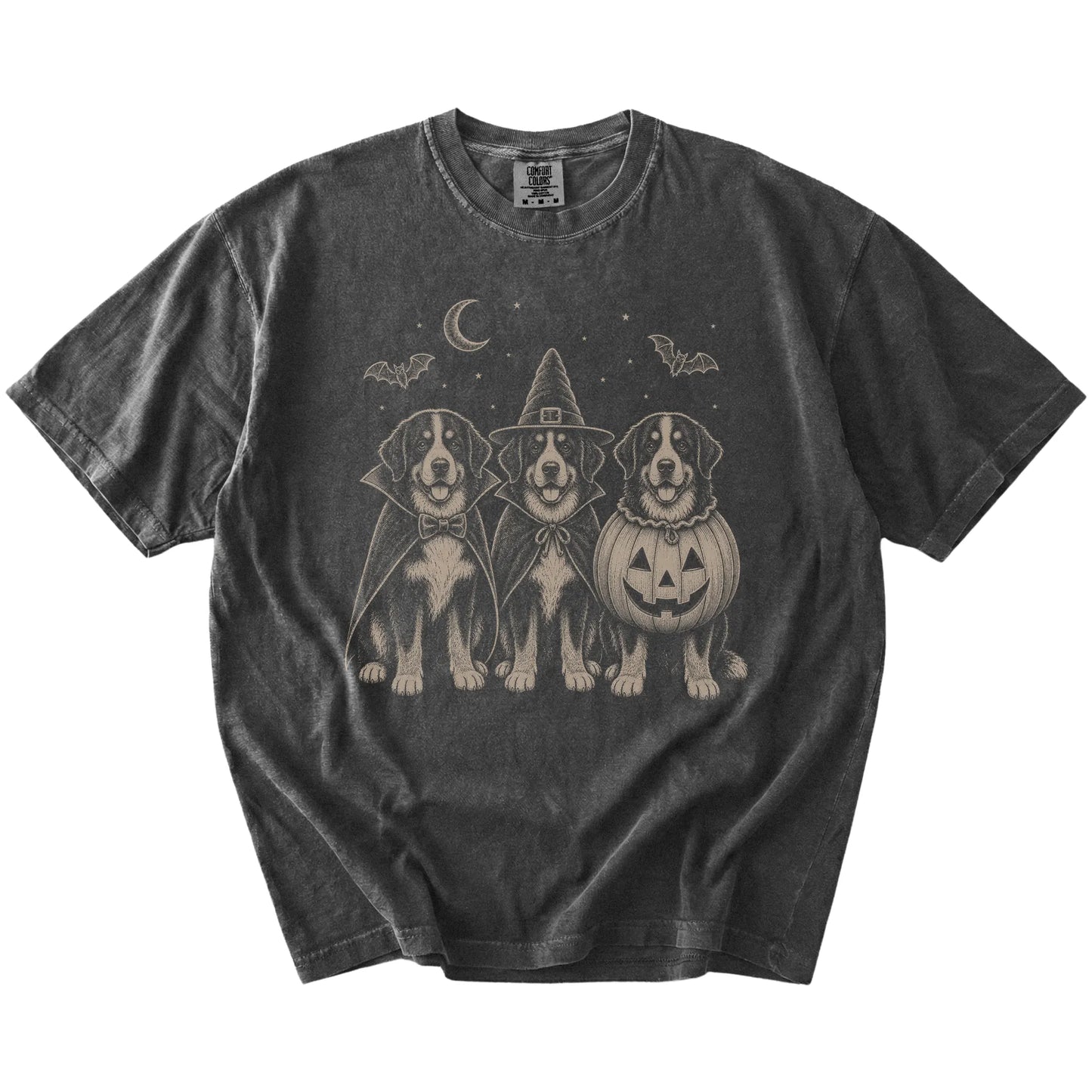 Three Bernese Mountain Dog dogs dressed for Halloween beneath bats and a crescent moon on a Pepper Comfort Colors® T-shirt