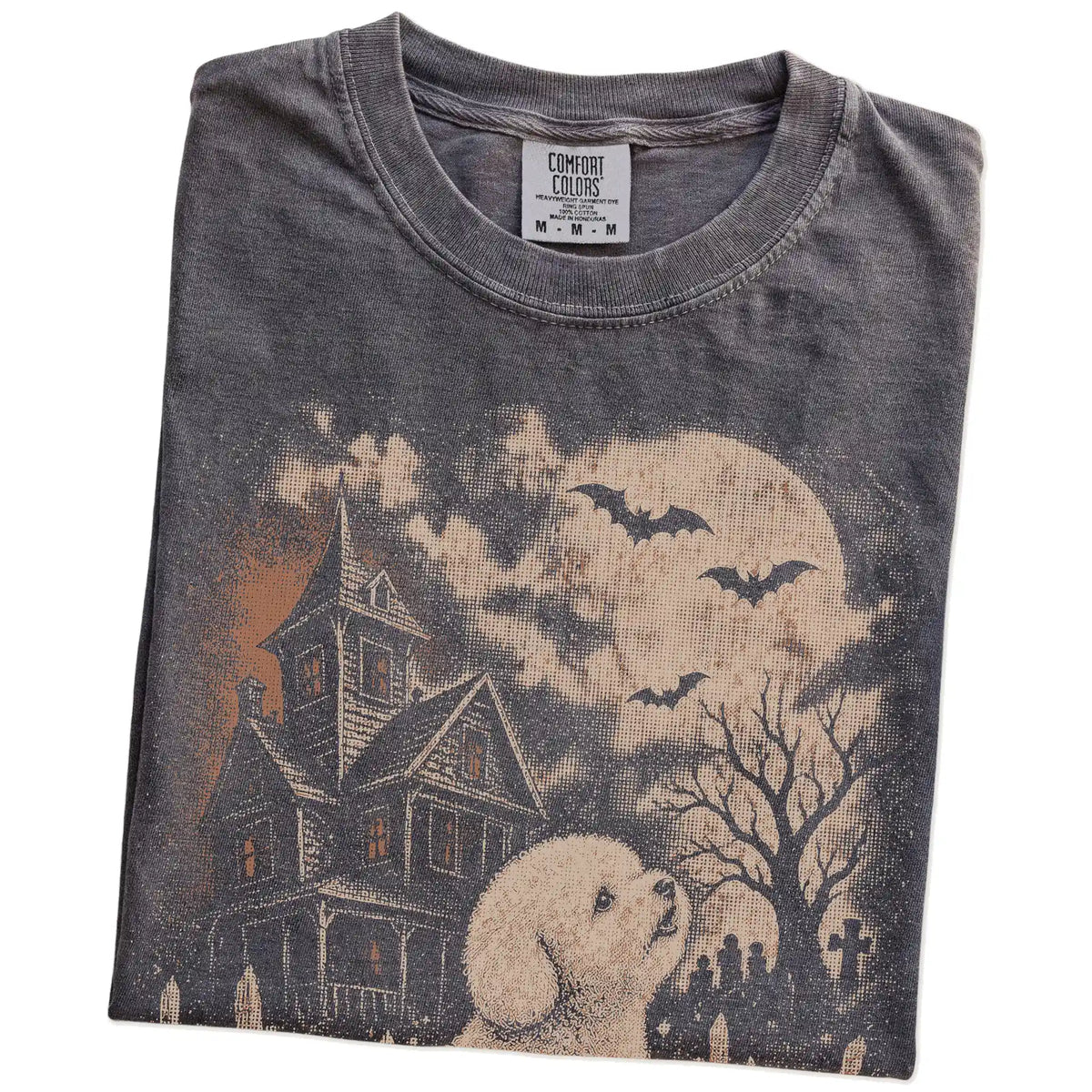 Folded Pepper Comfort Colors® T-shirt showing Bichon Frise in a vintage haunted-house scene