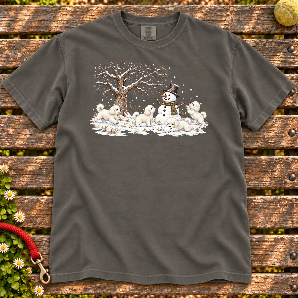 Bichon Frise puppies playing in snow with a snowman on a Pepper T-shirt