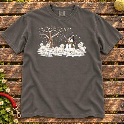 Bichon Frise puppies playing in snow with a snowman on a Pepper T-shirt