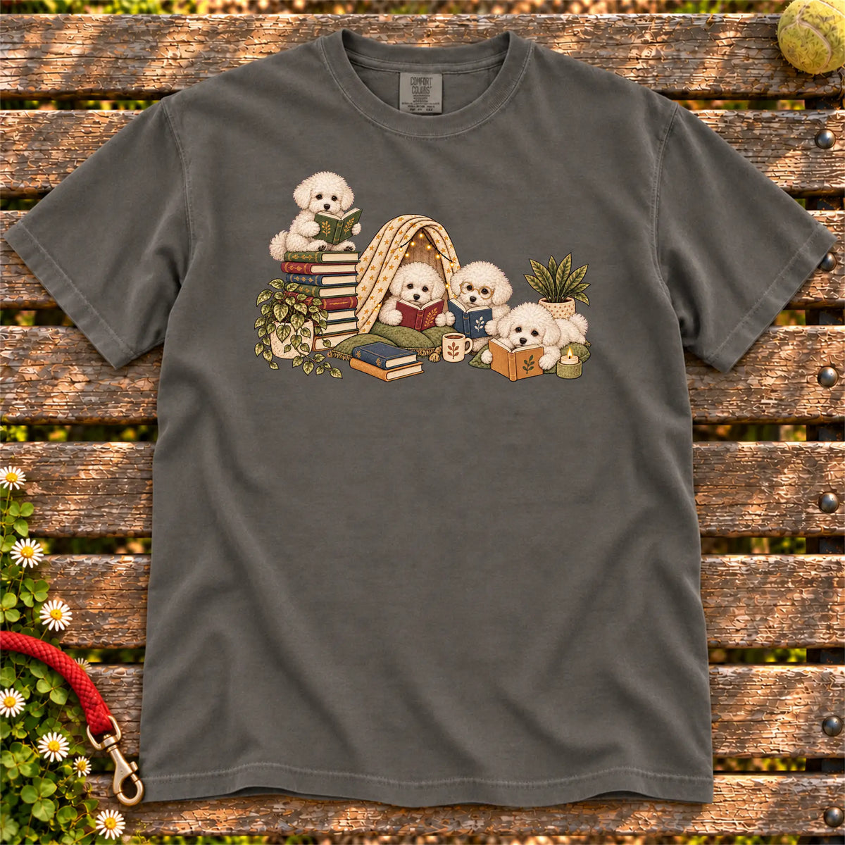 Bichon Frise puppies reading books in a cozy blanket fort on a Pepper T-shirt