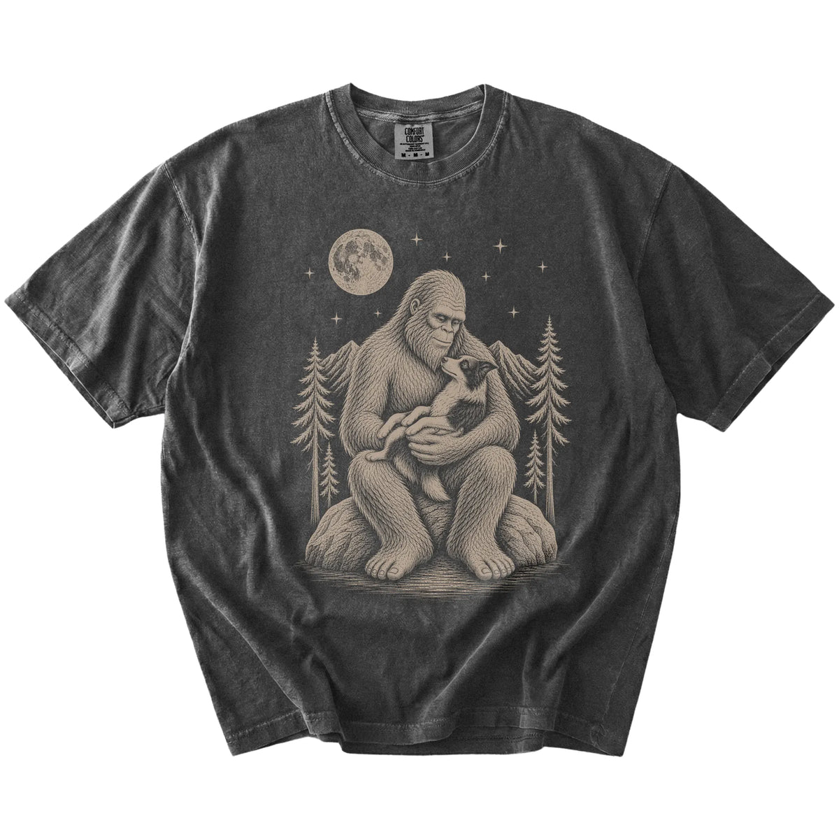 Bigfoot holding a Border Collie on a Pepper Comfort Colors® T-shirt