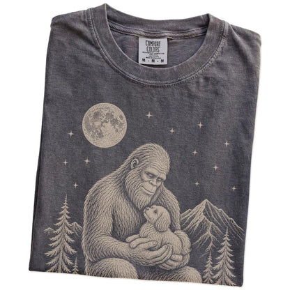 Folded Pepper Comfort Colors® T-shirt showing Bigfoot holding a Havanese