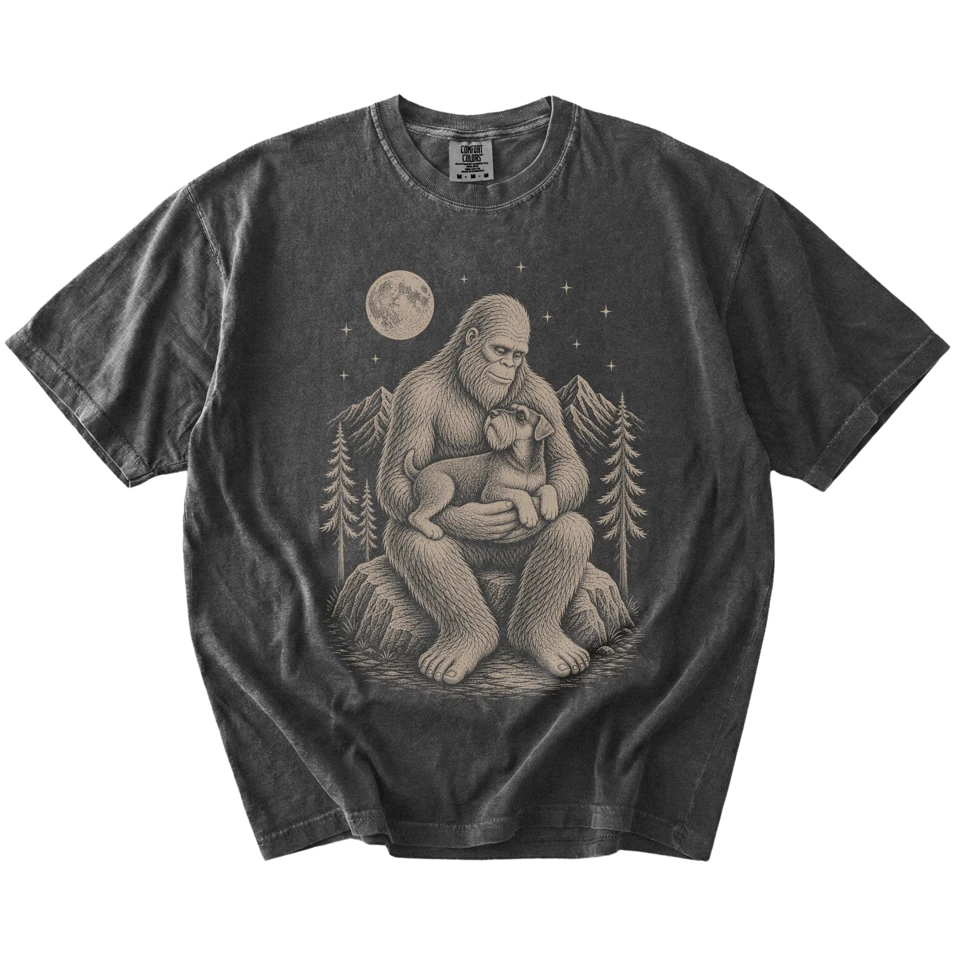 Bigfoot holding a Standard Schnauzer on a Pepper Comfort Colors® T-shirt