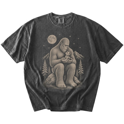 Bigfoot holding a Yorkie on a Pepper Comfort Colors® T-shirt