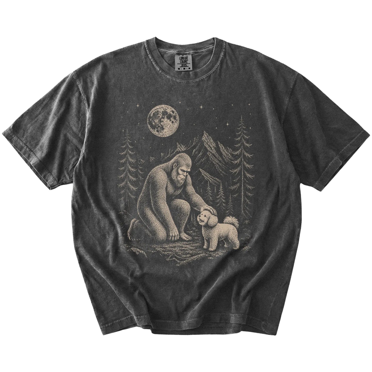 Bigfoot petting a Bichon Frise beneath the moon in a pine forest on a Pepper Comfort Colors® T-shirt